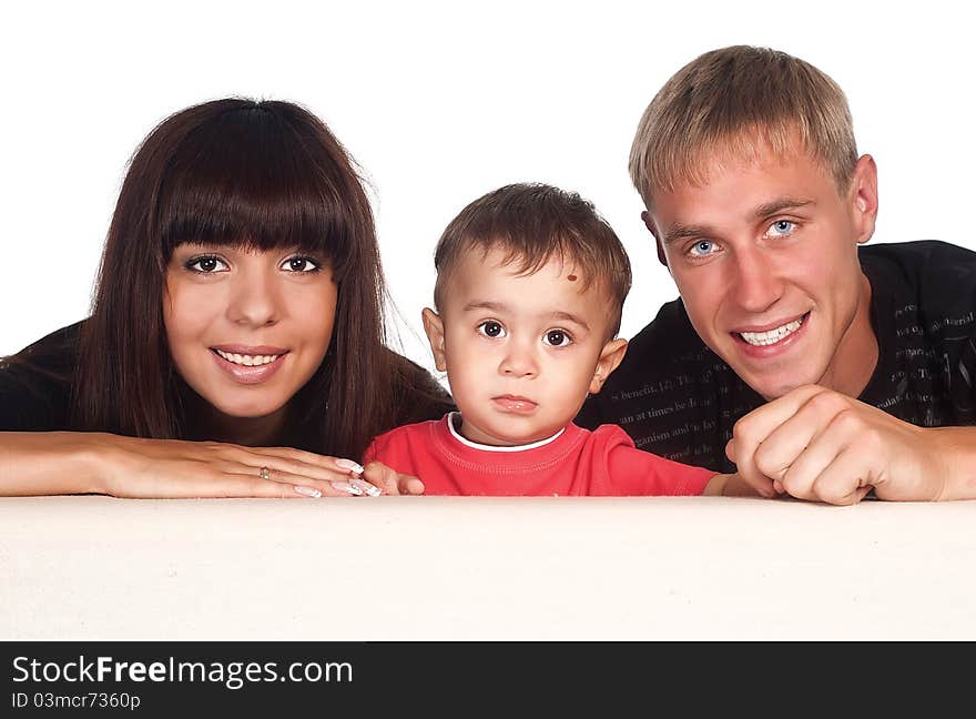 Portrait of a nice family of a three on sofa. Portrait of a nice family of a three on sofa