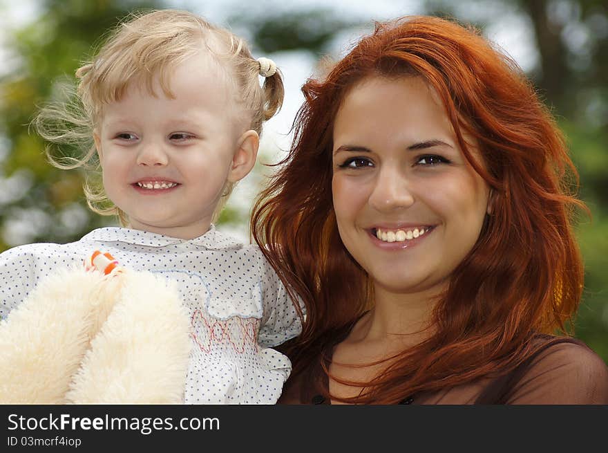 Young mom with her daughter at nature. Young mom with her daughter at nature