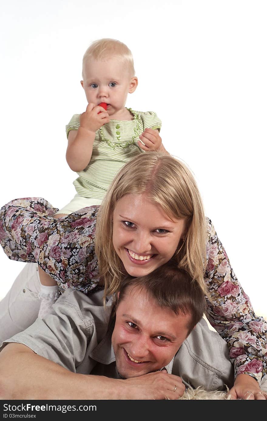 Portrait of a happy family on a carpet