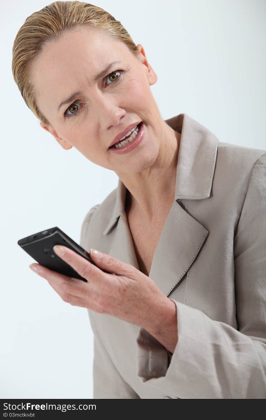 Closeup of a businesswoman holding cell-phone. Closeup of a businesswoman holding cell-phone