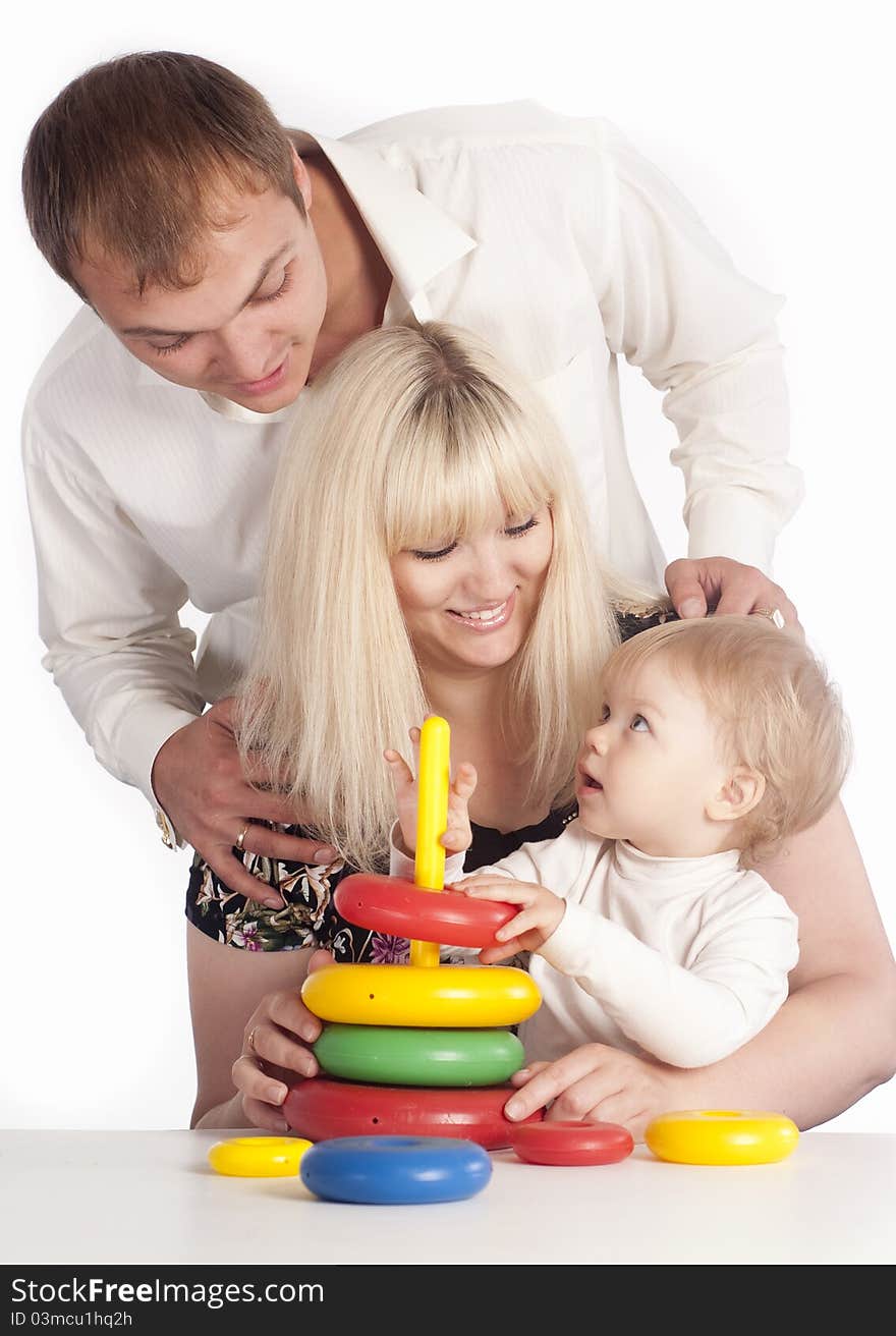 Portrait of a cute family playing at table