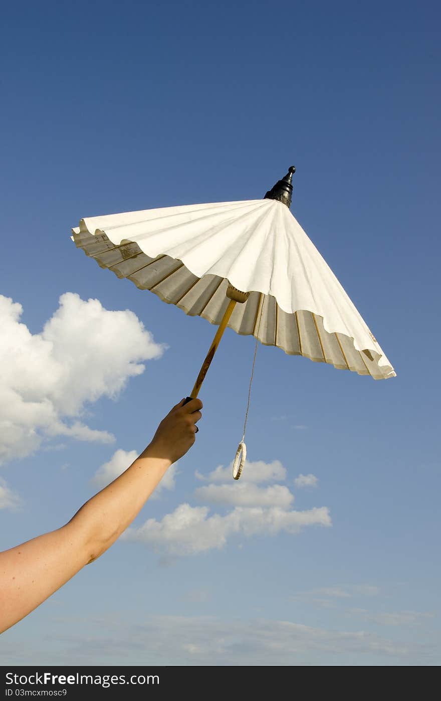 Woman hand holding umbrella