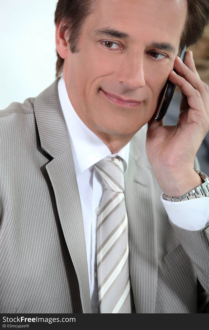 Portrait of an executive on cellphone