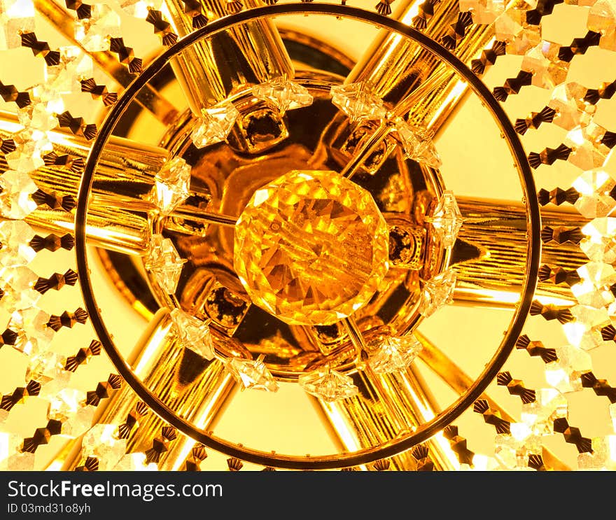 Yellow chandelier. macro. gold color.