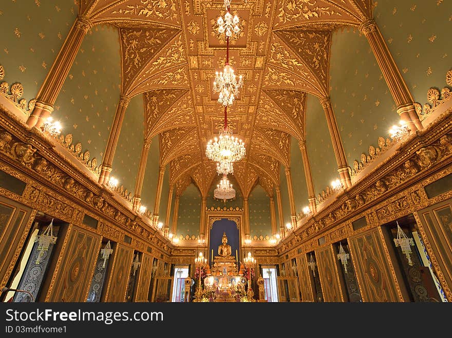 The golden interior decoration in the Buddhist Monastery of Wat Rajchaborpit that mixing of the Eastern and the Western style. Photo taken on: July 13rd, 2011. The golden interior decoration in the Buddhist Monastery of Wat Rajchaborpit that mixing of the Eastern and the Western style. Photo taken on: July 13rd, 2011