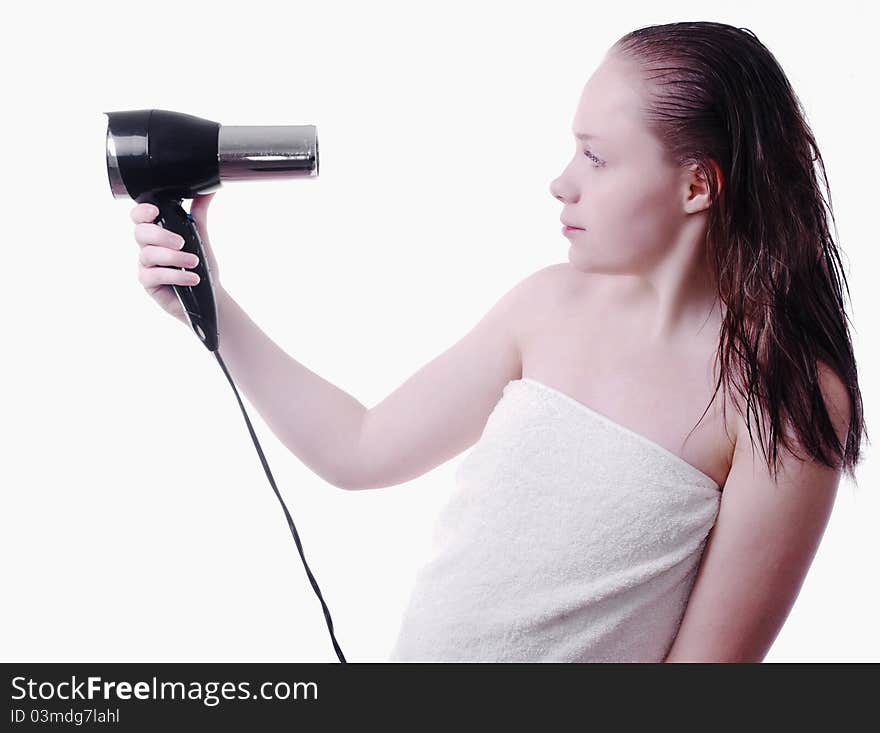 Soft picture of girl after shower with hairdryer