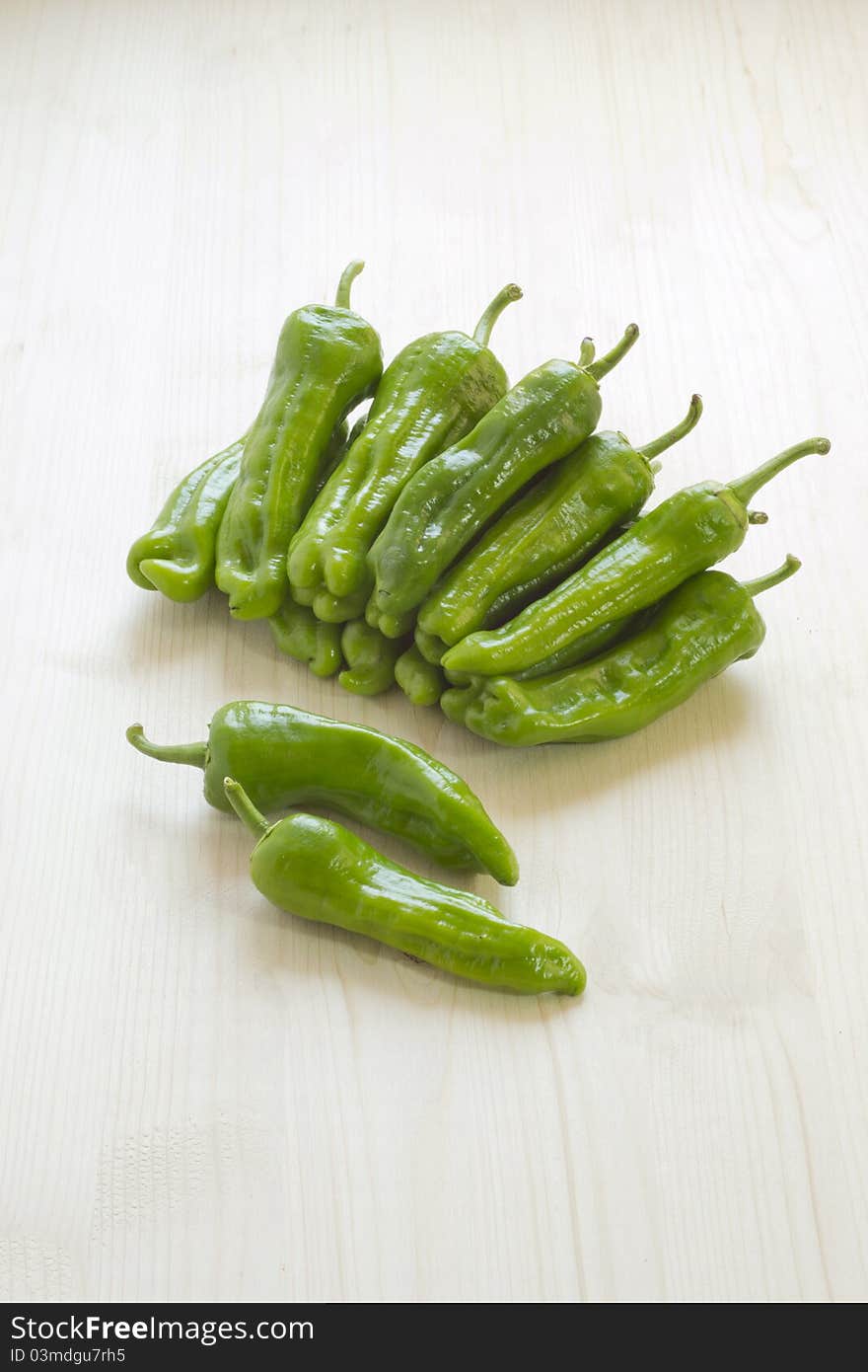 Sweet green peppers on a wooden table