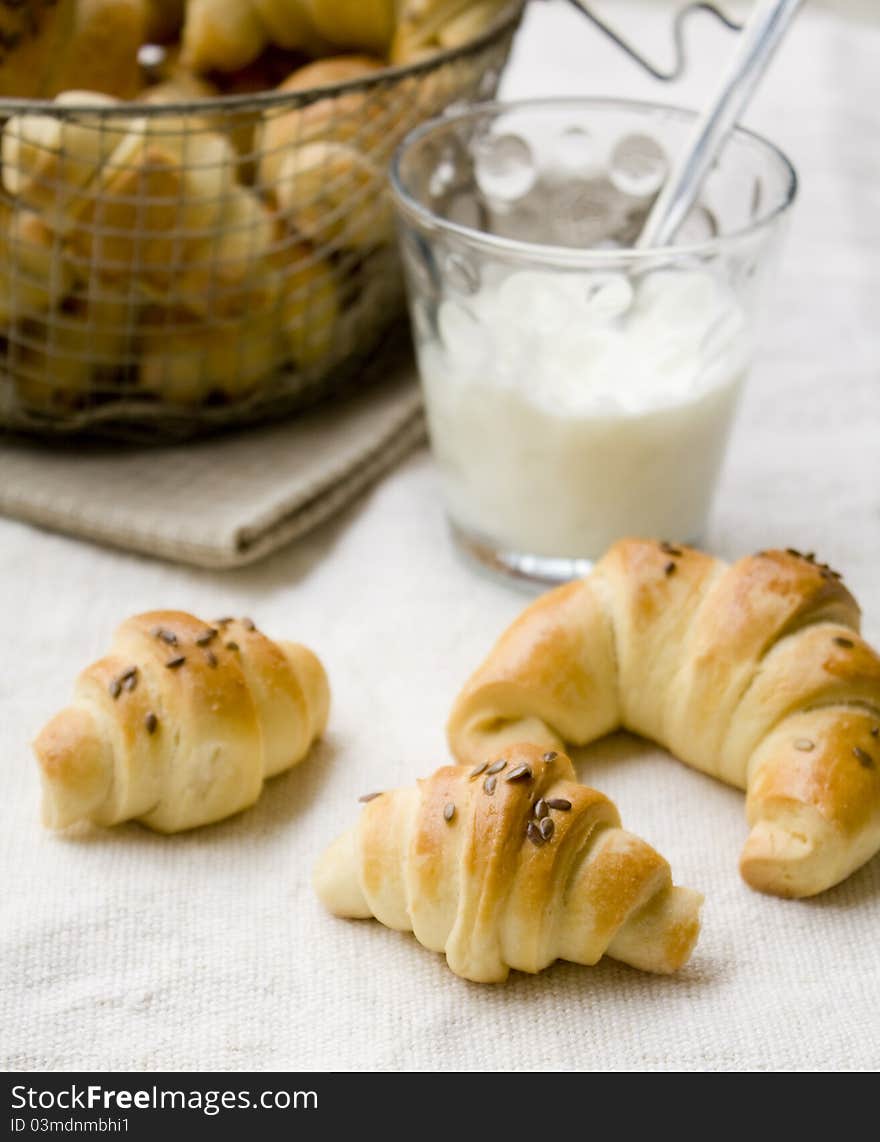 Homemade baked pastry on the table with a glass of milk. Homemade baked pastry on the table with a glass of milk