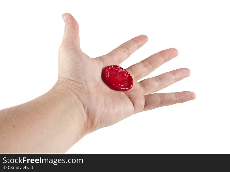 Condom in hand on the white background