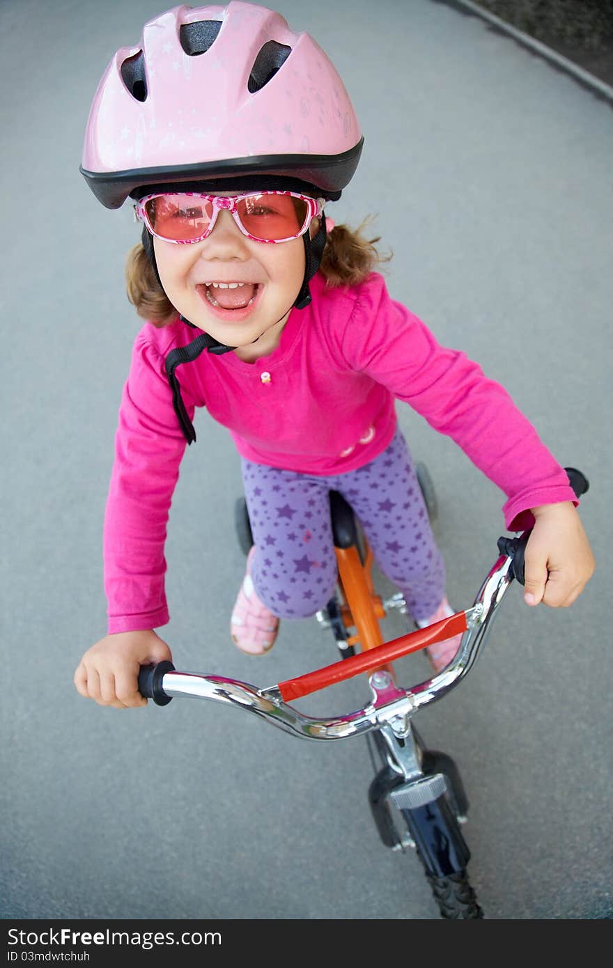 Portrait of a funny girl with a bicycle. Portrait of a funny girl with a bicycle