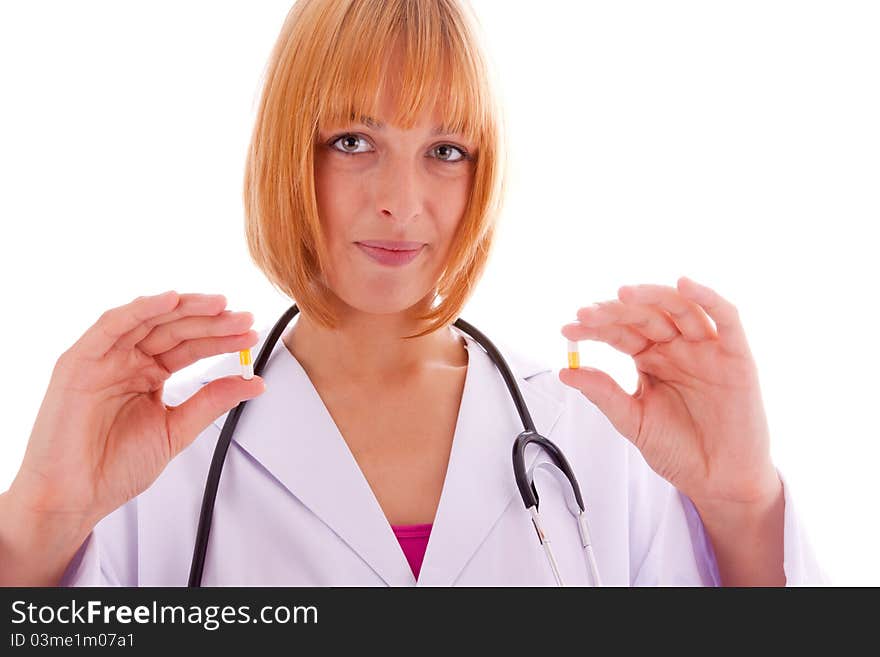 The young doctor with two tablets in his hand. The young doctor with two tablets in his hand