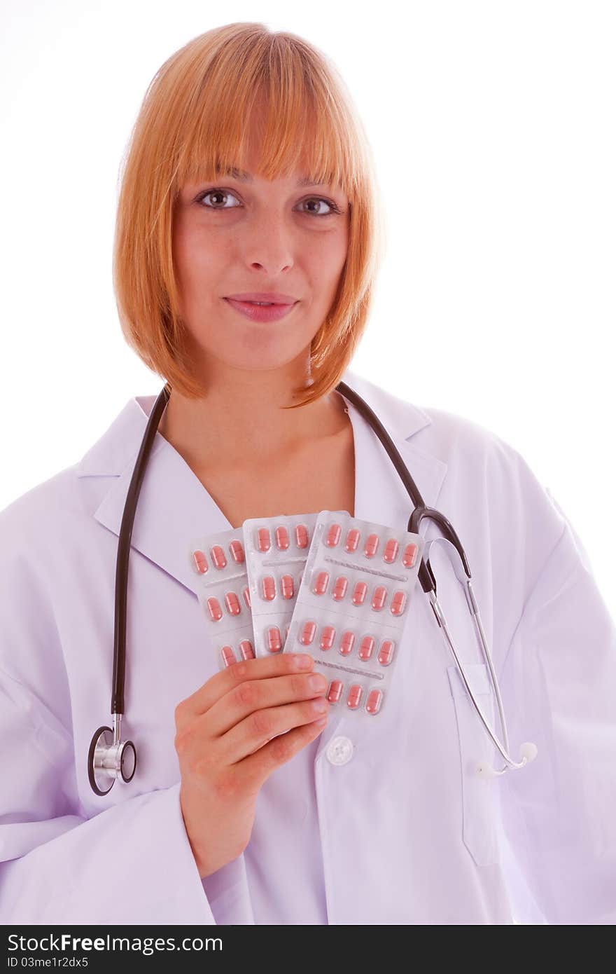 The young doctor with tablet packaging in the hand. The young doctor with tablet packaging in the hand