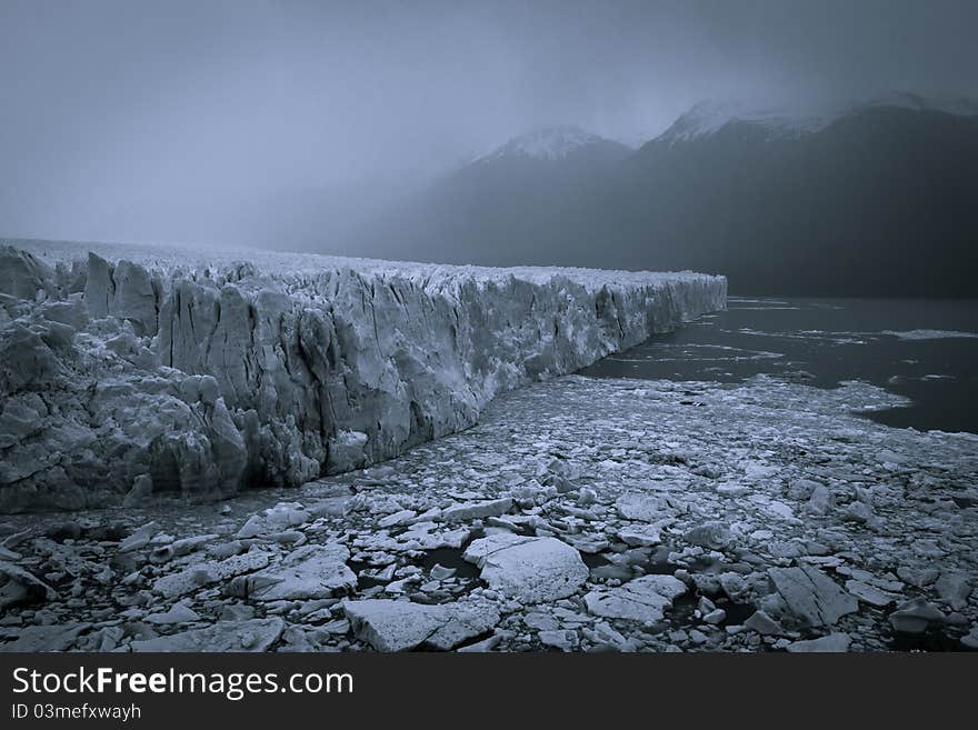 Rain and Haze over Perito Moreno Glacier in Los Glaciares National Park in Argentina