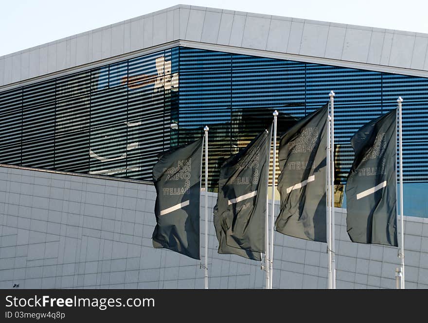 Picture of the 4 flags of Oslo opera, and the proud building in the bacground. Picture of the 4 flags of Oslo opera, and the proud building in the bacground