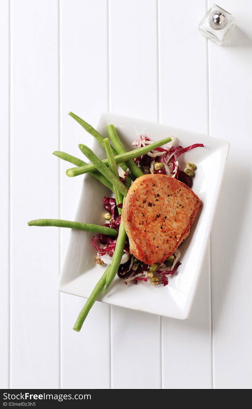 Pan fried pork chop and vegetables