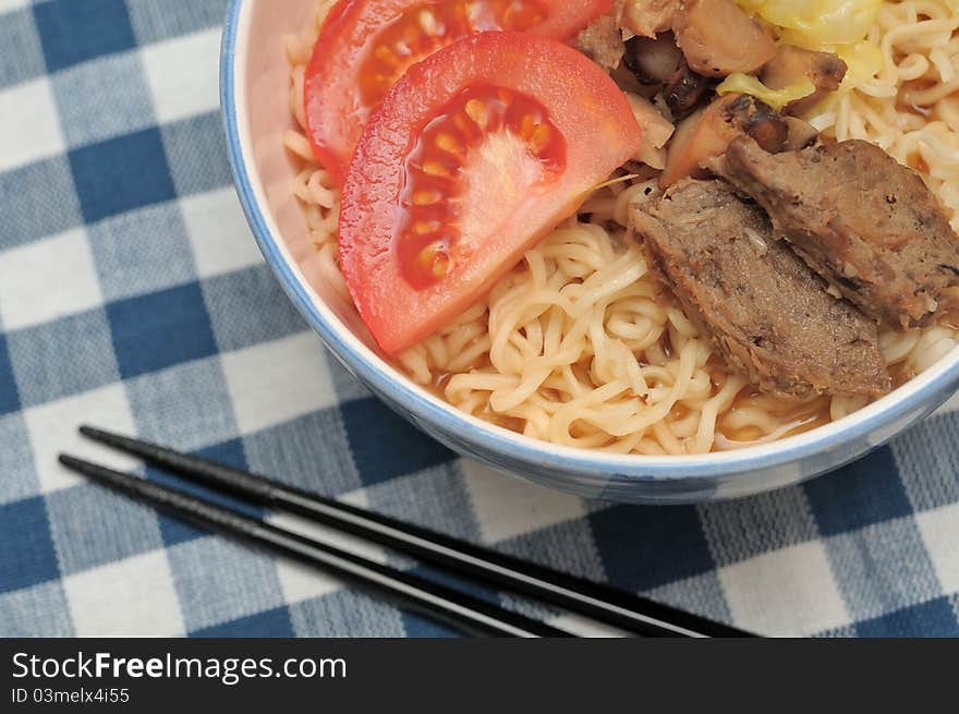 Closeup shot of healthy meat noodles prepared with fresh vegetables and vegetarian mutton slices. Closeup shot of healthy meat noodles prepared with fresh vegetables and vegetarian mutton slices.