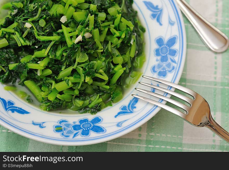 Simple dish of Oriental style cut vegetables with fork on plate. Simple dish of Oriental style cut vegetables with fork on plate.