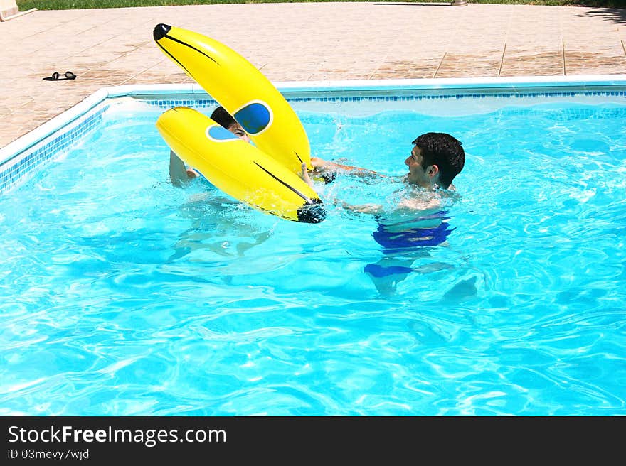 Couple having fun in swimming pool. Couple having fun in swimming pool.