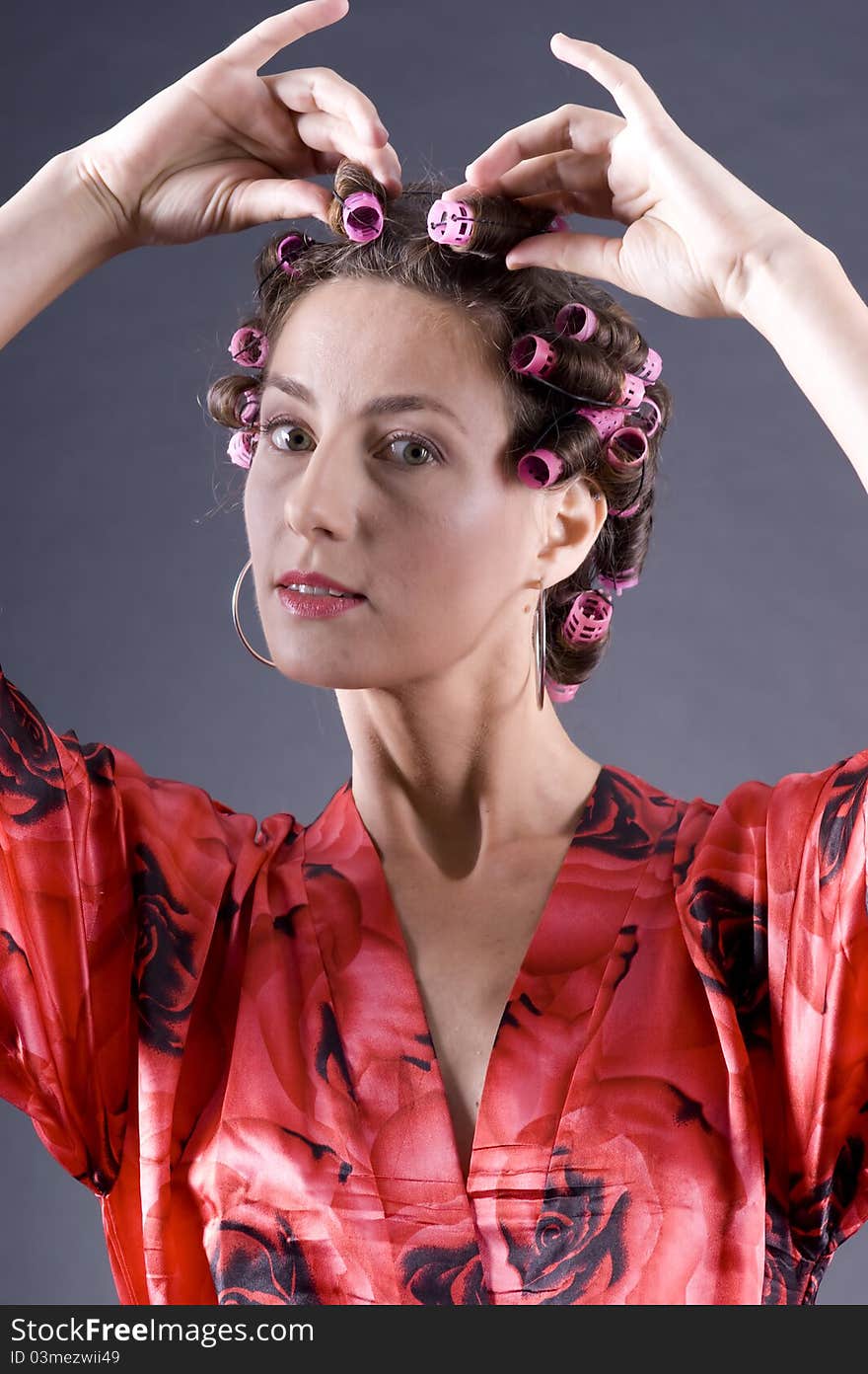 Beautiful young woman with bigoudi on the hair