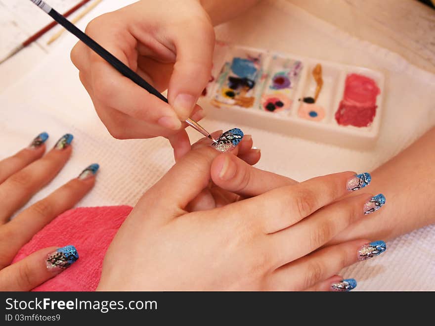 Hands during the manicure work.