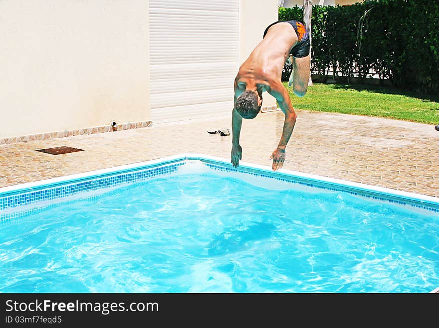 Man Jumping To Swimming Pool