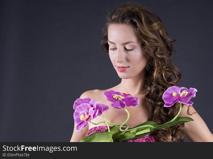 Beautiful young woman with long wavy hair