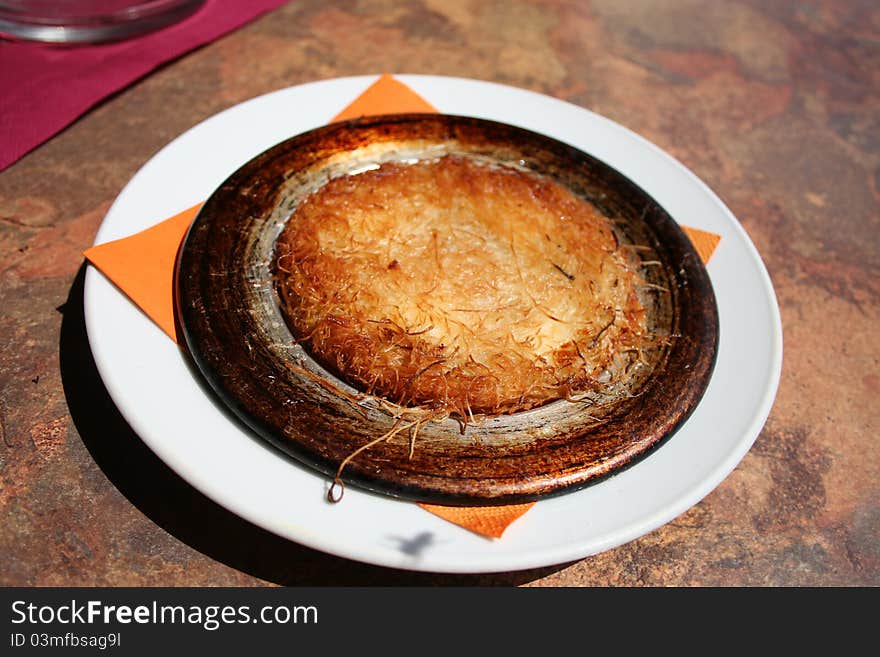 Turkish dessert (kadayif and cheese filling) served hot as a Turkish dessert. Turkish dessert (kadayif and cheese filling) served hot as a Turkish dessert