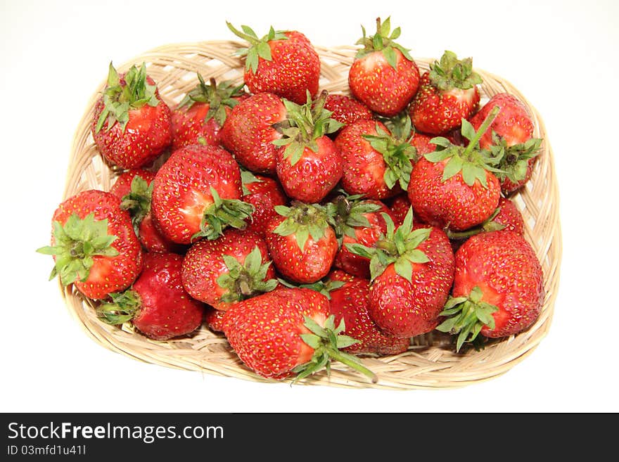 Much fresh strawberry with leaves in a basket. Much fresh strawberry with leaves in a basket