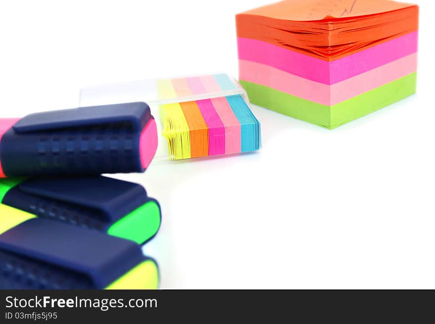 Colorful papers and markers on white background. Colorful papers and markers on white background.