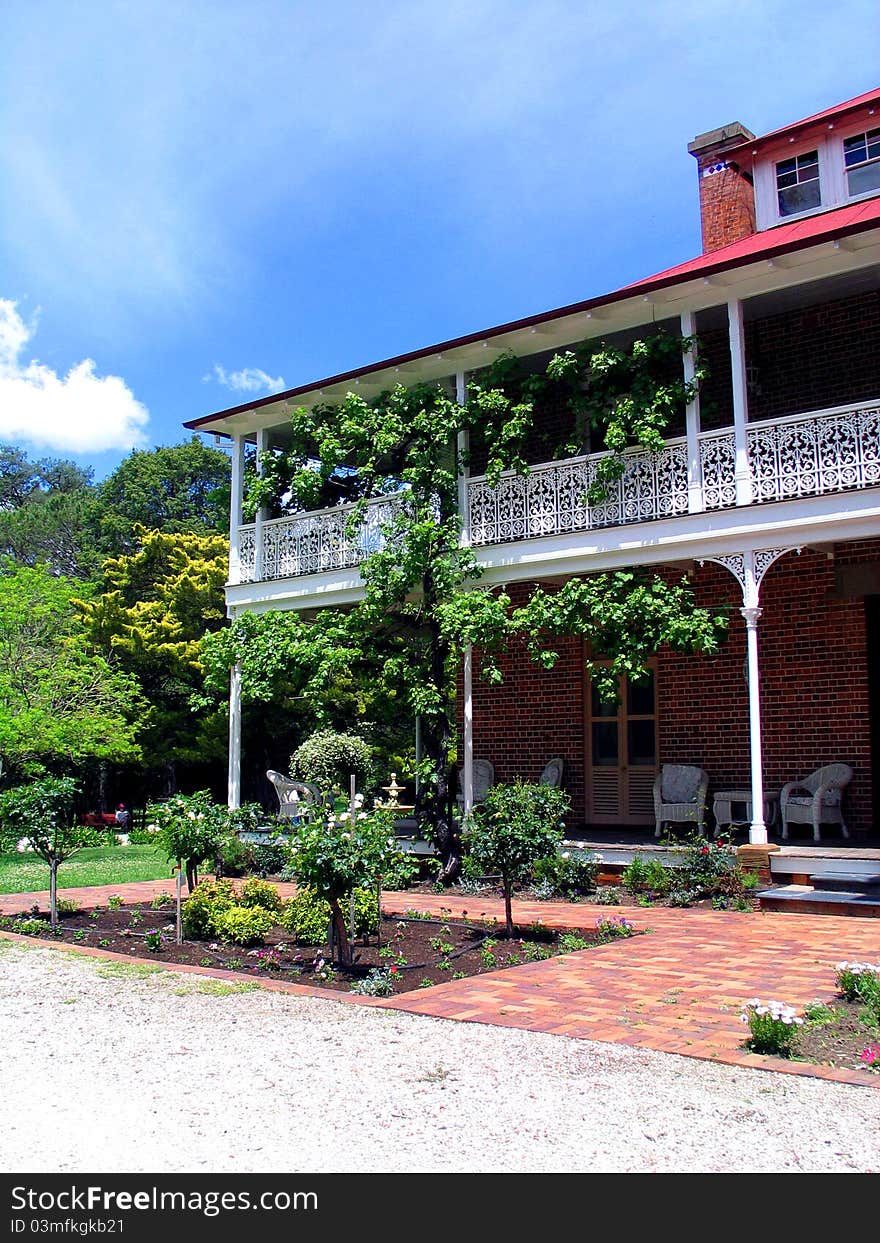 Grand building surrounded by sunny garden. Grand building surrounded by sunny garden.