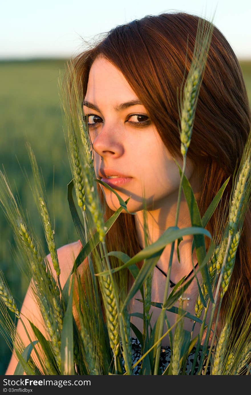 Young woman and cereal crops