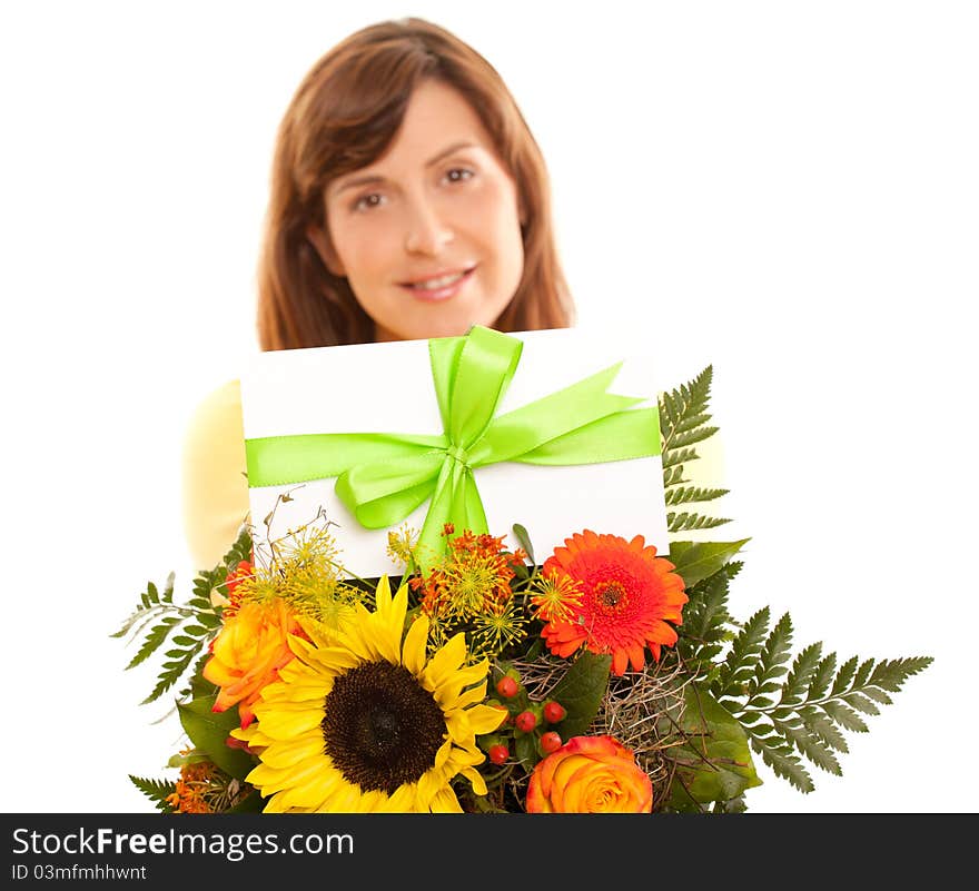 Beautiful woman holding coupon on flowers