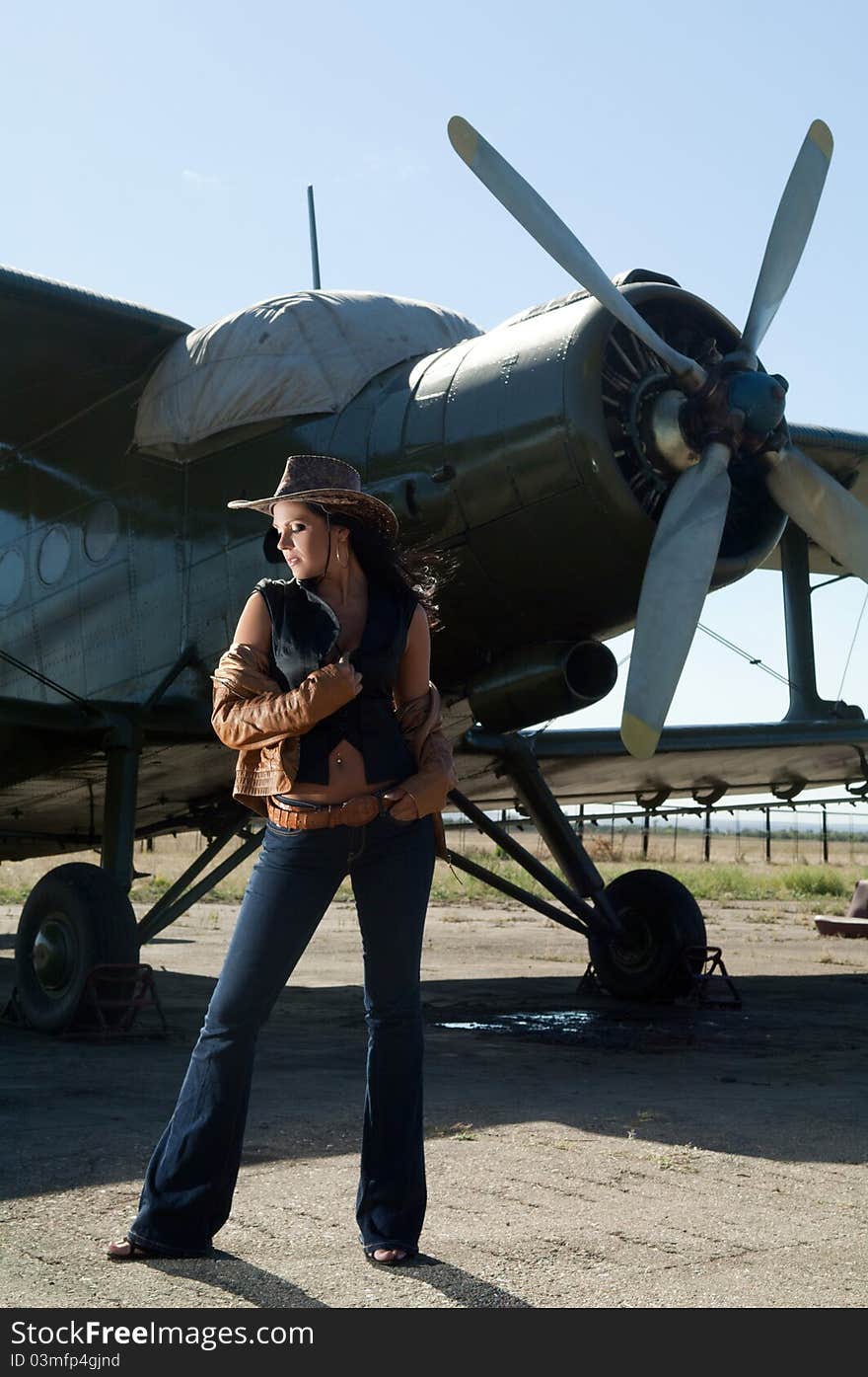 Woman in jeans and aircraft