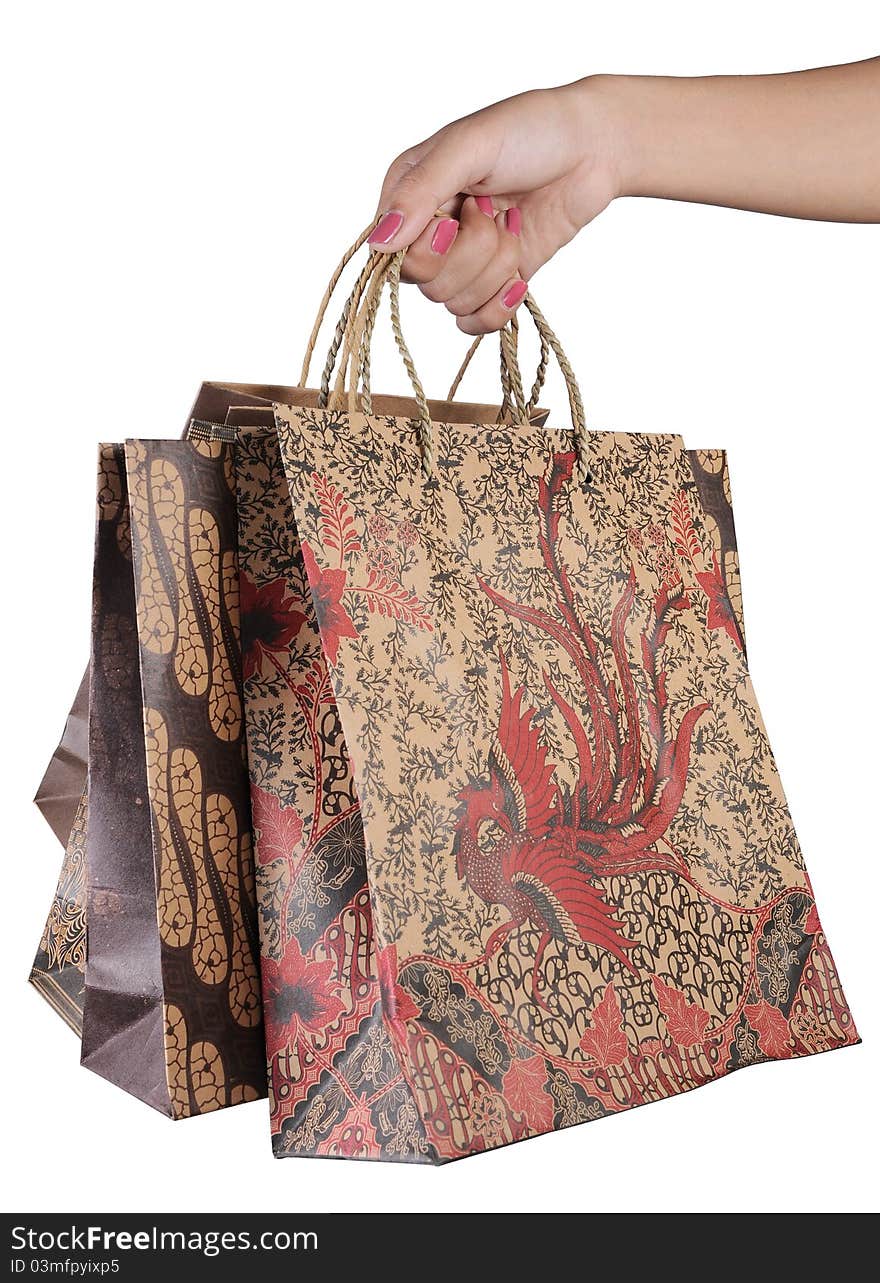 Female hand holding shopping bags