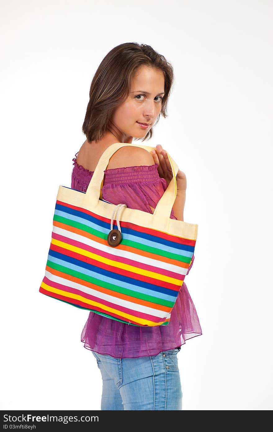 Beautiful woman holding beach bag