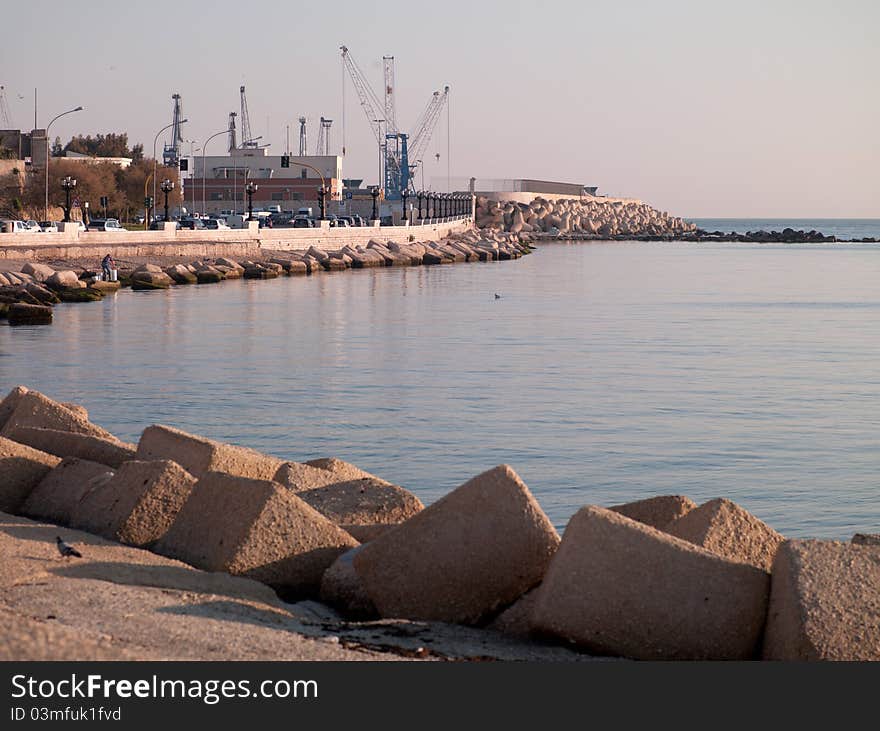 Port with cranes for loading goods on ships