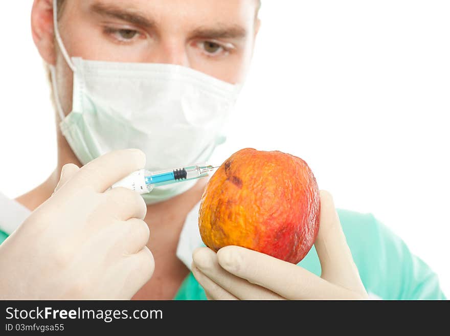 Man with injection and apple. Man with injection and apple