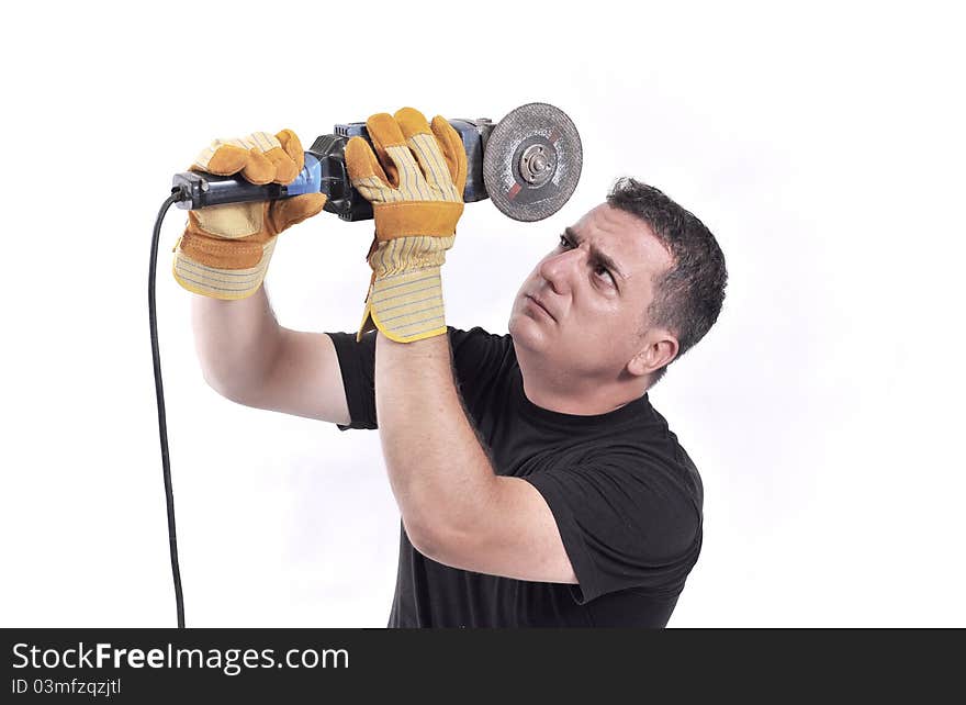 Expressive man with a grinder in his hands isolated on white.