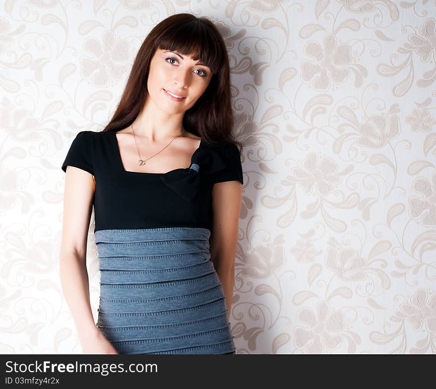 Cute Young Girl Against A Wall