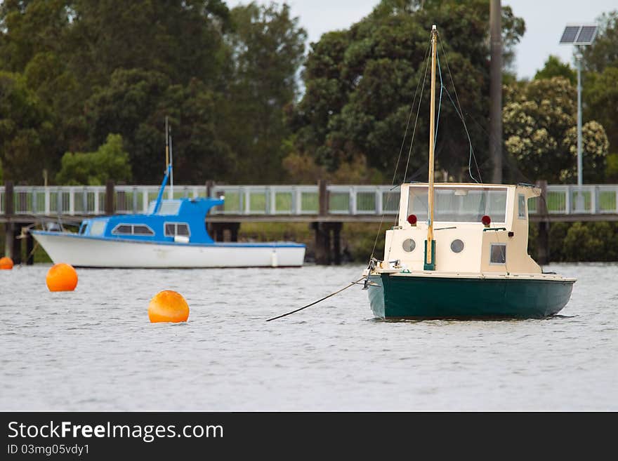 Old fishing boats in a harbour with selective focus