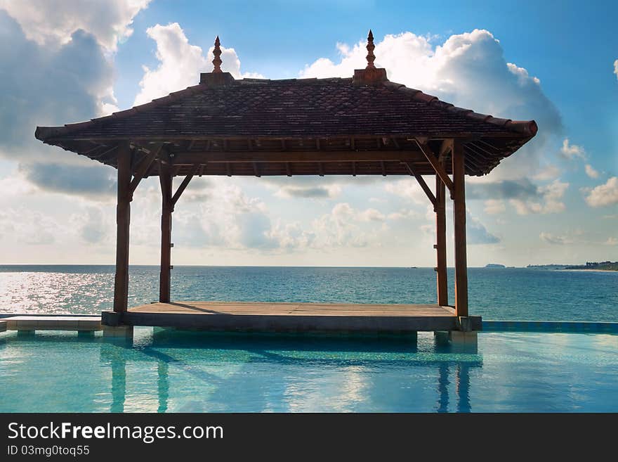 Wooden Asian style pavilion on the ocean beach. Wooden Asian style pavilion on the ocean beach