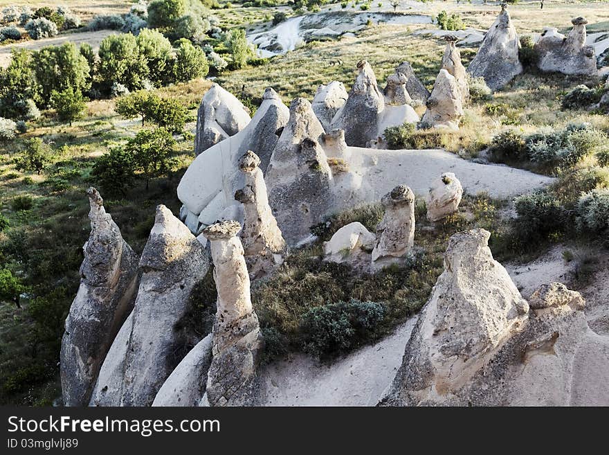 Aerial view of semicircle of fairy chimneys, naturally weathered limestone with small ravine, copy space, crop area, landscape, vista. Aerial view of semicircle of fairy chimneys, naturally weathered limestone with small ravine, copy space, crop area, landscape, vista