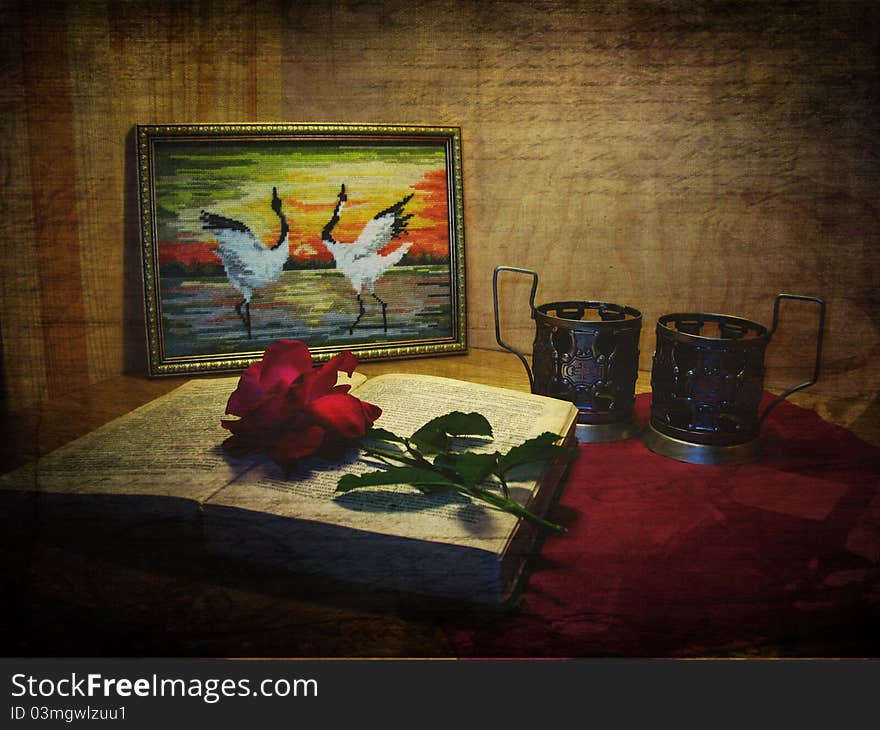 Vintage postcard with grunge background, picture, cranes, book, rose and glass-holder