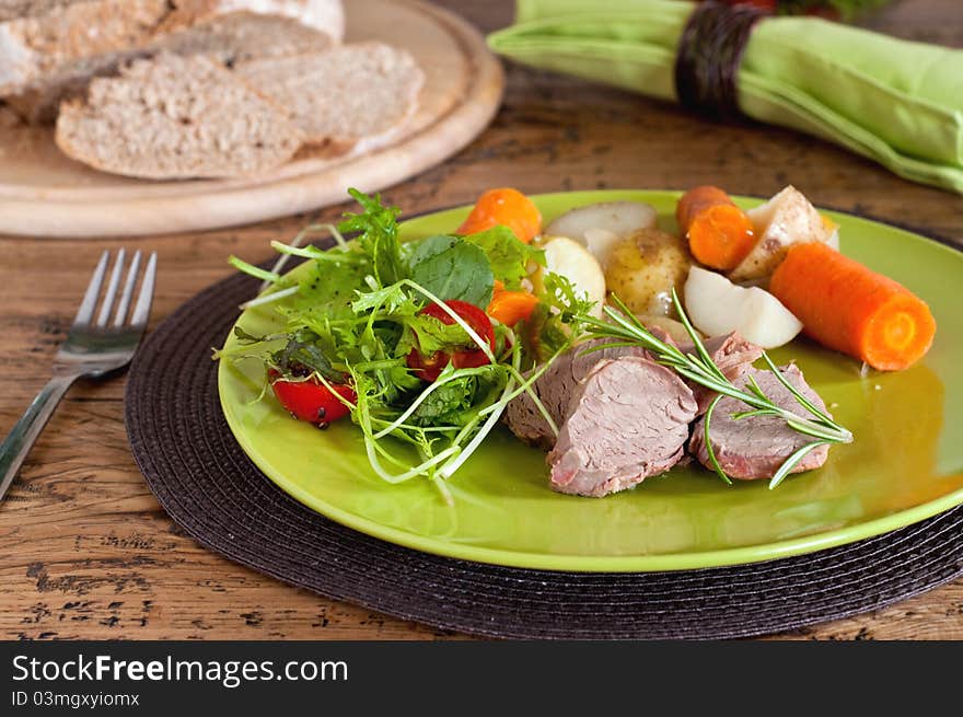 Pork tenderloin with potato and salad