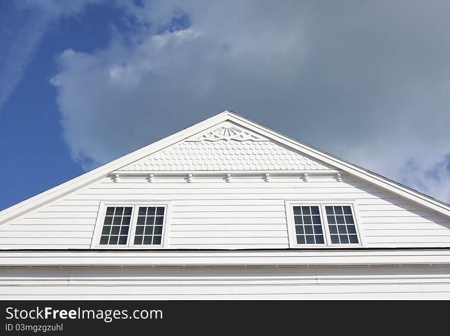 Front view of house and cloudy sky