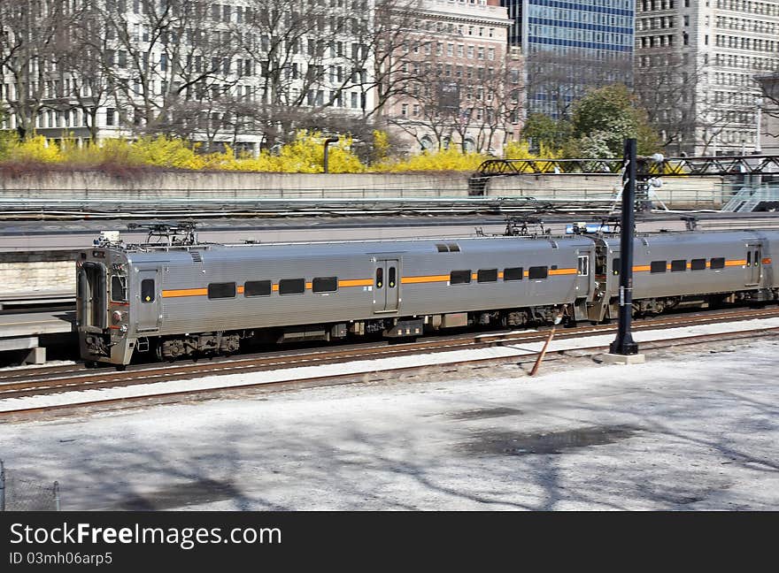 Commuter train in downtown area leaving the station