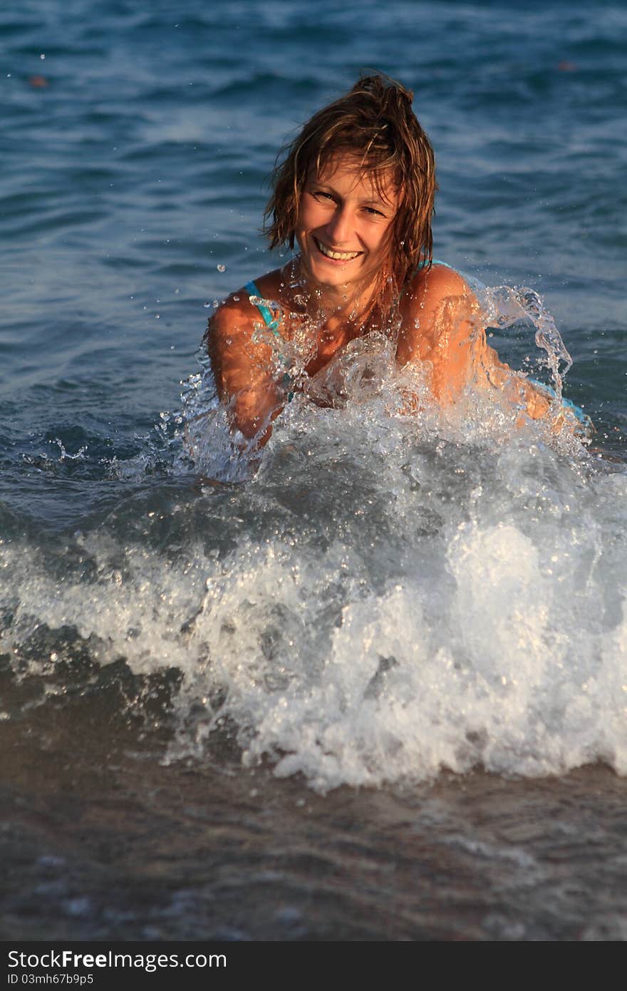 Girl having fun in the sea. Girl having fun in the sea