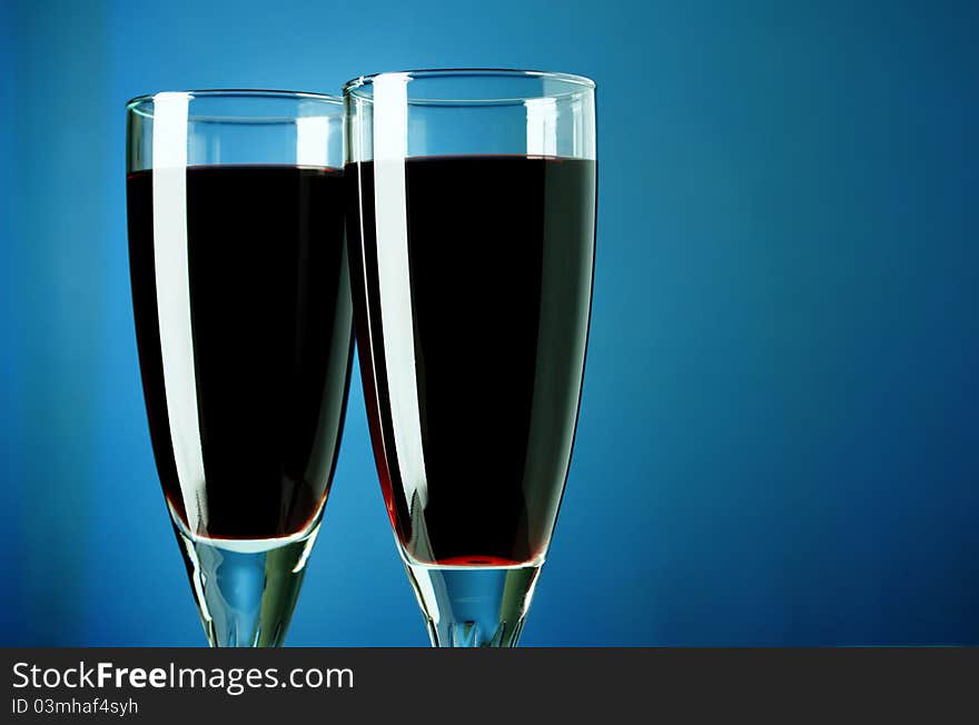 Wine Bottle And Glass On A Blue Background