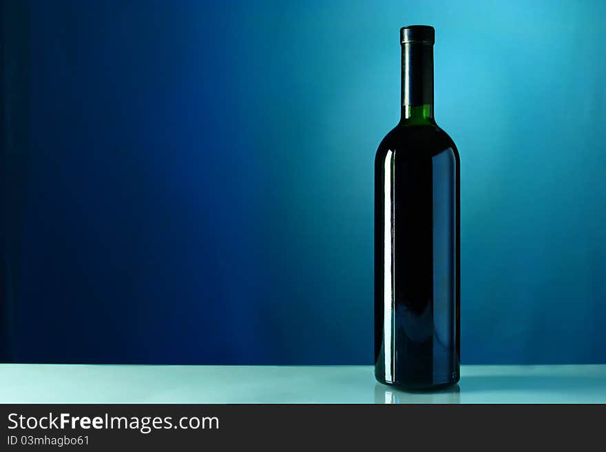 One bottle of wine on a blue background