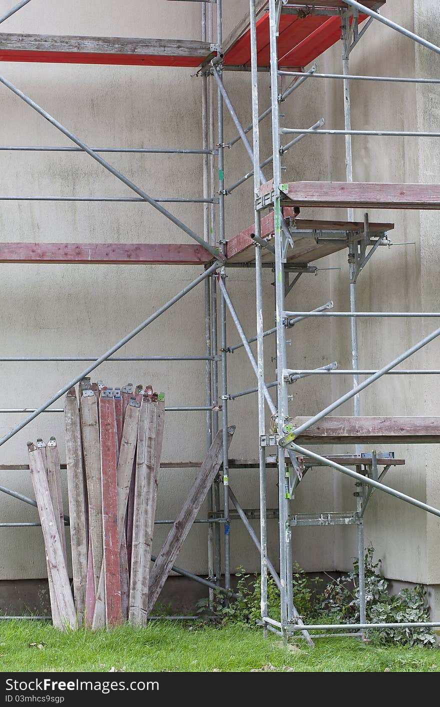 Scaffolding on a building wall. building getting a new paint. Scaffolding on a building wall. building getting a new paint.